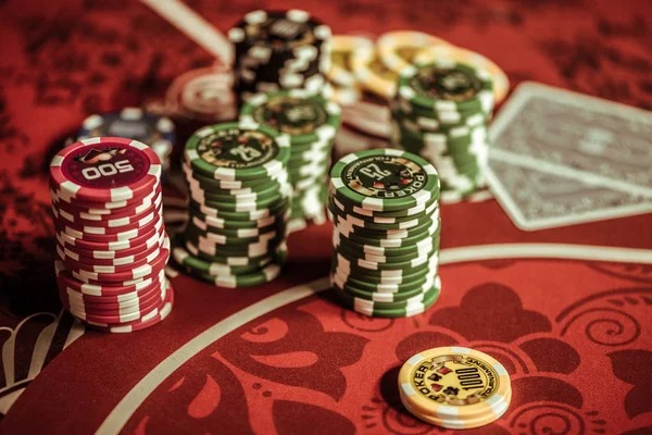 Live Casino Hold'em table with professional dealer and multi-camera setup